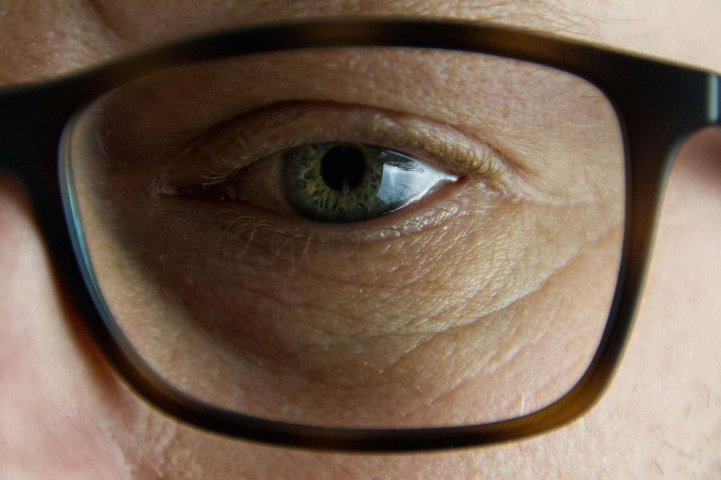 close up of an eye and glasses
